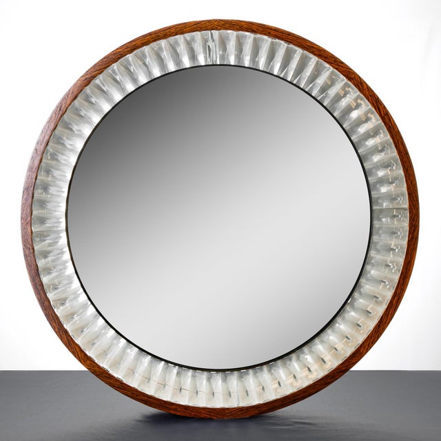 We are offering a rare round wall mirror from the 1960s, framed in dark wood and crystals. It is unlit, but open at the...