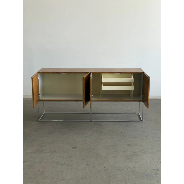 W72 D18.25 H34.5 1970s Milo Baughman for Thayer Coggin olive burl wood credenza. Fully refinished to highlight the...