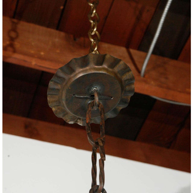 French iron chandelier. Cast iron detail on a circular fixture. Newly wired; four candelabra sockets will each take a...