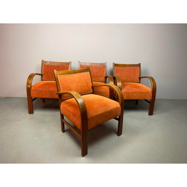 A beautiful and exceptionally comfortable set of four Dutch Art Deco armchairs, dating from the 1930s. The chairs feature...