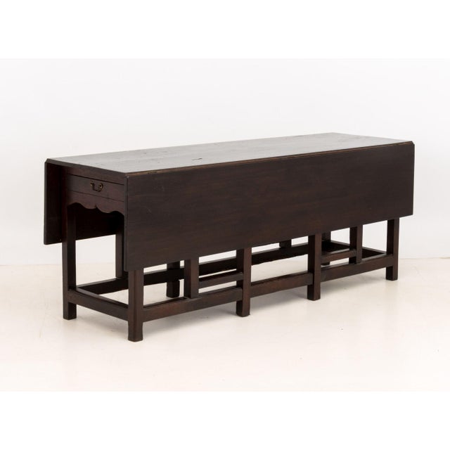 Georgian Mahogany Gate-Leg Dining Table, with two drawers. Closed: 30.5" H x 79.25" W x 23" D; open: 30.5" H x 79.25" W x...