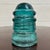 This is a gorgeous antique teal glass Hemingray No 12 insulator embossed “HEMINGRAY 12.”Produced by the Hemingray Glass...
