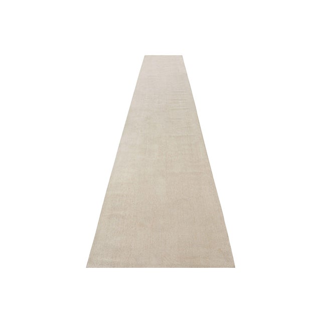 Hand-knotted in a luxurious blend of wool and silk, this extra-long 3x18 runner rug is a new addition to Rug & Kilim’s...