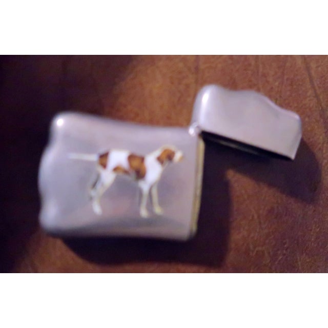 This shaped match safe with enamel decoration of a hunting dog is quite striking (no pun intended). I really like vestas...