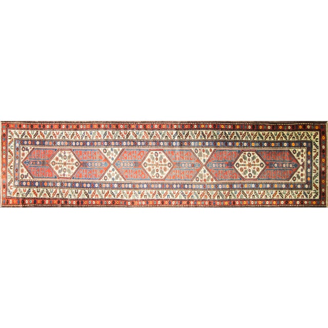 This exceptional Antique Caucasian Kazak Kurdish Runner, woven around 1900, is a striking example of the bold geometric...
