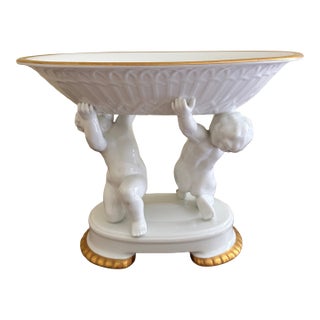 Early 20th Century Neoclassical Porcelain Compote With Cherub Supports and Gilt Detail For Sale