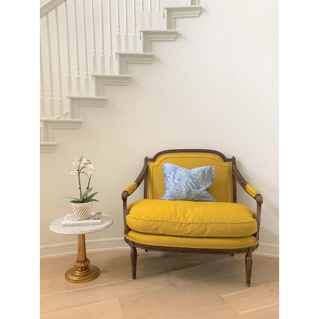 Vintage petite brass drinks table / occasional table featuring a round Carrara marble top on a giltwood pedestal base....
