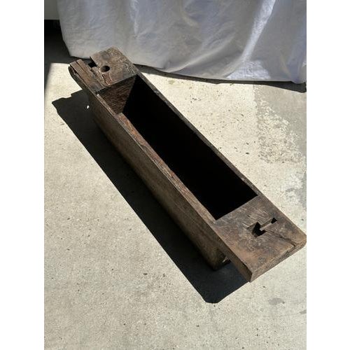 Old traditional Asian teak chest for storing rice. Beautiful quality of thick wood. The natural roughness of the wood...