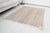 This is a vintage Turkish Oushak rug from the Mid 20th Century. The piece was hand-knotted.