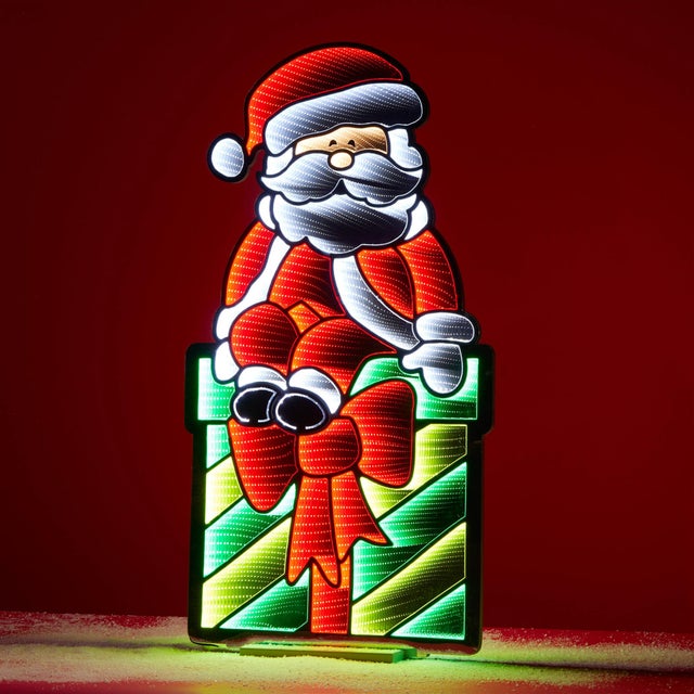 Bring festive cheer to your holiday décor with this vibrant Santa on Gift Package Ekkolight. Standing 47 inches tall, this...