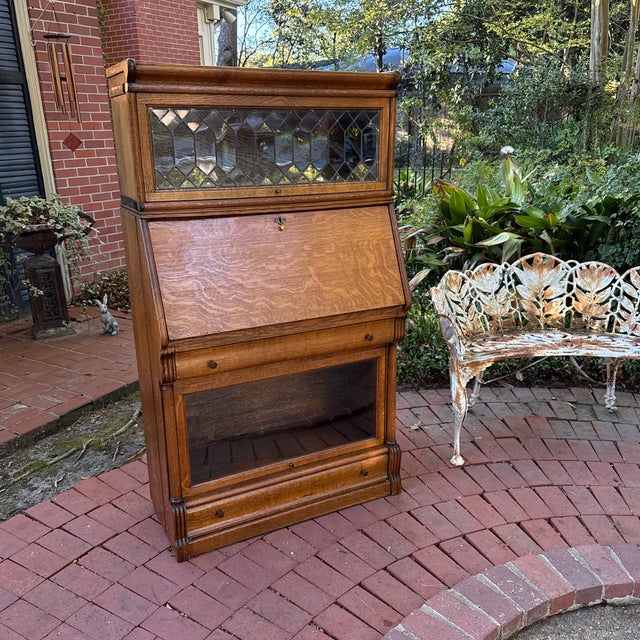 Antique Macey quartersawn or tiger oak barrister bookcase. The top with diamond shaped lighted glass. A slant front...