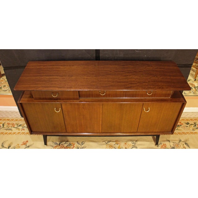 Mid Century Modern G-Plan "Librenza" credenza, English. Stamped "EG, E. Gomme, High Wycombe, G-Plan". The floating top is...
