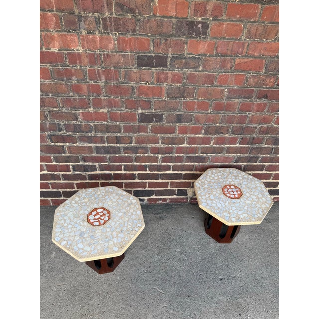 Pair of Harvey Prober travertine side tables with brass inlay and a tangerine color in the middle with walnut base.