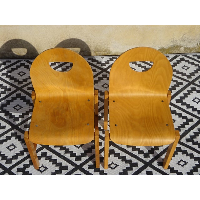 Set of 2 original, sturdy, and comfortable chairs in very light wood. The seat and backrest are made of laminated wood on...