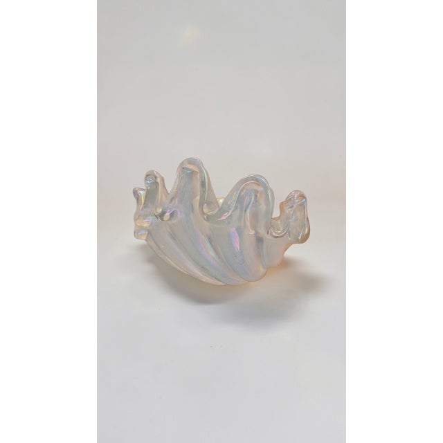 Wall lamp designed by Ercole Barovier for Barovier & Toso: shell-shaped in heavy iridescent clear glass with deep ribs and...