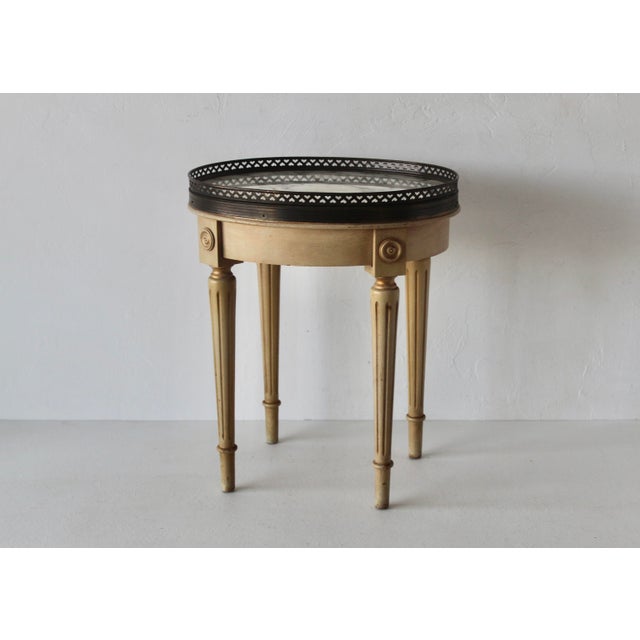 Vintage French Louis XVI style oval marble top small bouillotte drinks side table with brass gallery, and some gold...