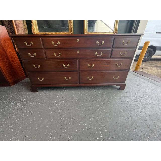 Mahogany dresser by Henkel Harris featuring dovetail drawers and brass hardware.
