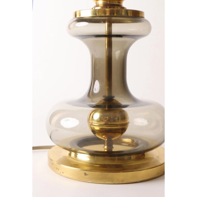 The lampshade is new. Dimensions without the shade. This piece is attributed to the mentioned designer/maker. It has no...