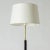Elegant midcentury floor lamp, made from brass with a leather dressed stem. Black lacquered base. European Plug (up to...