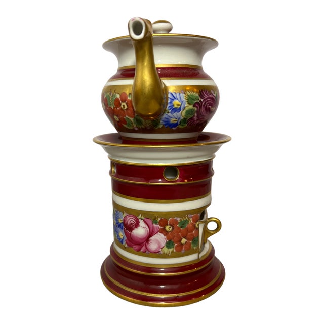 This exquisite 19th century French porcelain veilleuse-tisanière exemplifies the elegance of period tableware. The...