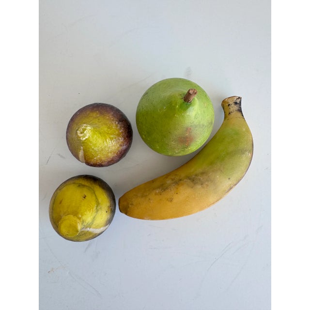 A group of fruits to add to your kitchen or dining room decor. Hand carved from alabaster stone in a pleasing colorway.