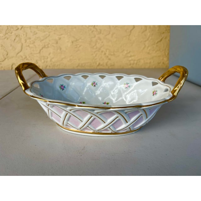 Vintage Porcelain Open Weaved Pink and Gold Bowl. This would be great for serving bread. Small pink flowers on the inside....