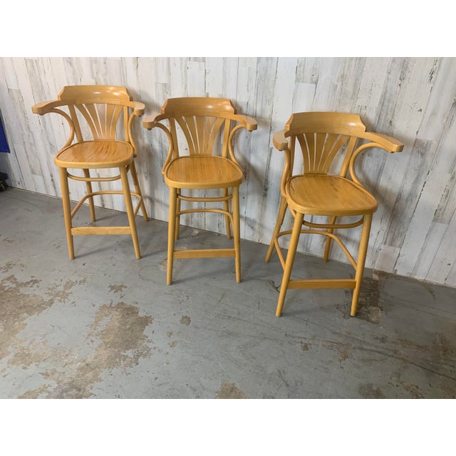 A beautiful set of three vintage bentwood barstool height chairs manufactured by Polish furniture maker Radomsko ZMG. The...