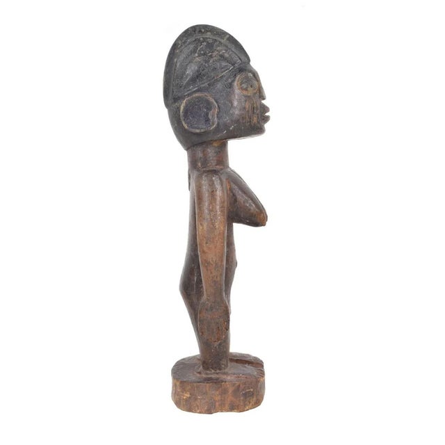 Ibeji figures, carved by the Yoruba people of Nigeria, are wooden twin sculptures holding cultural significance in Yoruba...