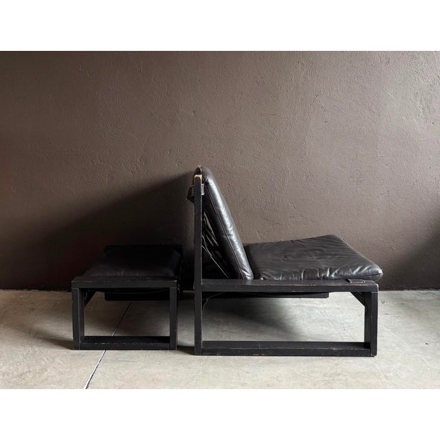Low lounge chair & ottoman, designed by Atelier Sonja Wasseur, featuring a solid very dark brown (almost black) wooden...
