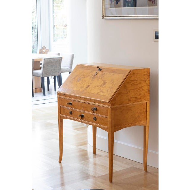 A refined and functional piece in warm honey-toned birch veneer – this Scandinavian secretary desk embodies timeless...