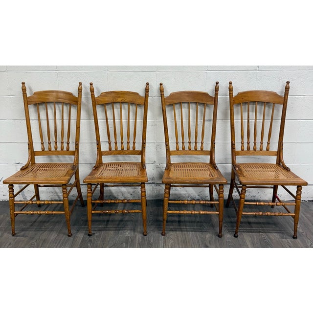 This is a beautiful set of four vintage solid oak dining chairs featuring classic Country Colonial or Victorian styling...