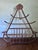 This vintage bentwood hat and coat rack includes a uniquely designed "cage" for gloves and scarfs, and is accented by...