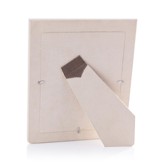A perfect fusion of natural texture and refined craftsmanship, this tabletop photo frame features woven raffia carefully...
