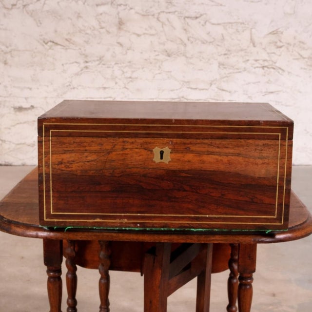 This 19th Century English Campaign Writing Box is a charming and highly collectible antique that reflects the ingenuity...
