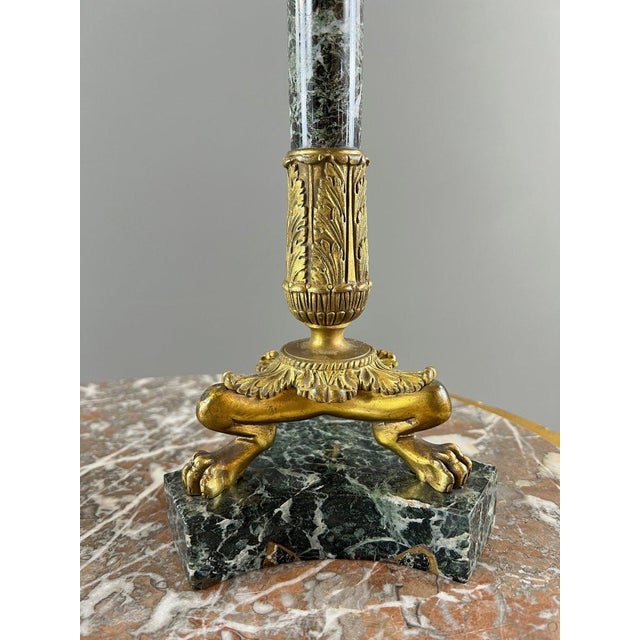 Pair of gilt bronze and green marble candelabra A refined pair of four-light candelabra in finely chased and gilt bronze....