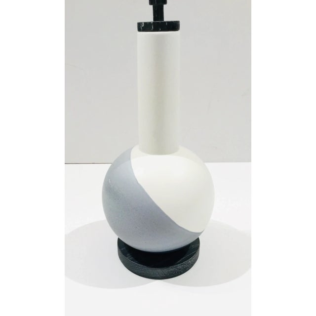 Danish Modern Style White and Gray Hand Dipped Ceramic Bottle, black cerused oak base and stopper, showroom floor sample