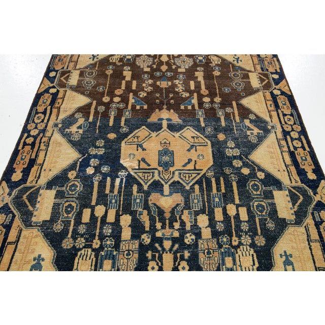 Beautiful vintage Persian hand-knotted wool rug with a beige, brown, and blue field. This piece has an all-over geometric...