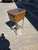 Great end table with an iron base, and leather and glass Vitrine Display case box top the top section interiordisplayarea...