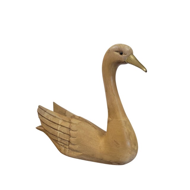 This elegant hand-carved wooden swan is a refined example of Italian Mid-Century Modern decorative art, dating from the...