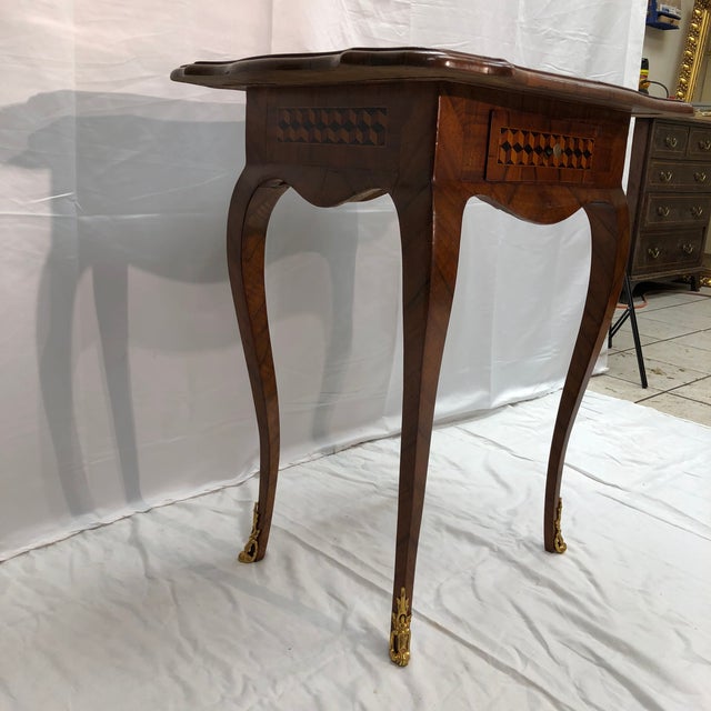 Fine 18th century Louis XVI style walnut marquetry side table with light and dark maple wood, an 8-point natal star, and...