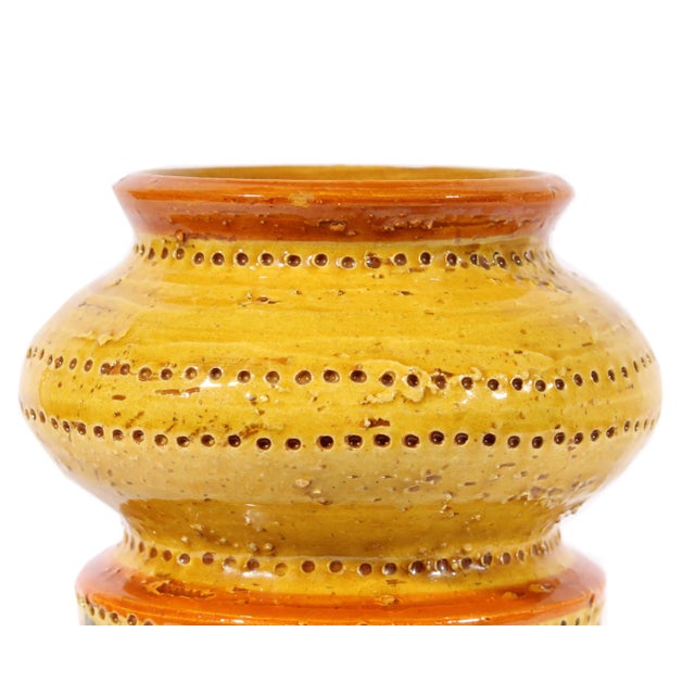 A ceramic Bitossi vase in the Liberty pattern. Produced for Rosenthal Netter, the vase features a yellow glaze with an...