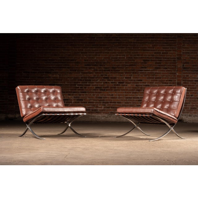 c. 1970s-1980s; Knoll International, Inc. - New York, New York An iconic pair of Barcelona chairs featuring hand-tufted...