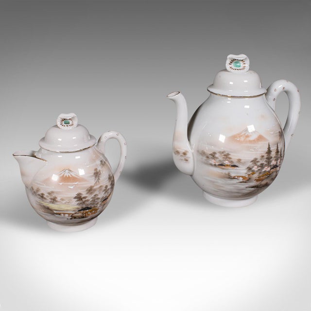 This is an antique Kutani tea service. A Japanese, porcelain 6 person teapot and cups set, dating to the late Victorian...