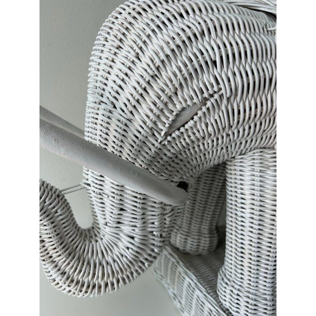 Charming, vintage, white wicker elephant side table or plant stand. Eclectic, boho accent piece. This table was probably...