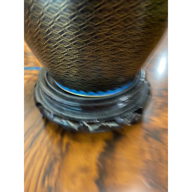 Beautiful black Asian lamp with lotus flower details. Perfect for the interior designer.