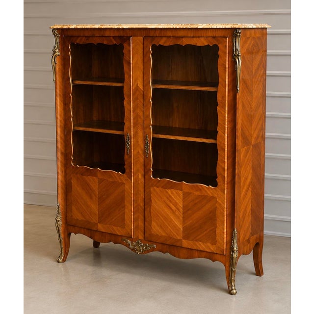 You will love this French satinwood bookcase. For books or displaying your favorite collectibles, this piece works well in...