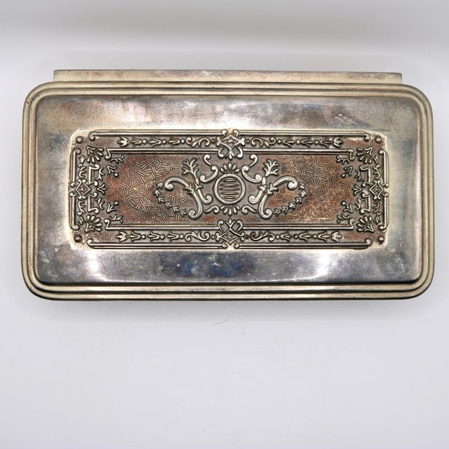 An elegant mid-century modern Italian silver-plated footed jewelry casket or trinket box designed in the grand...