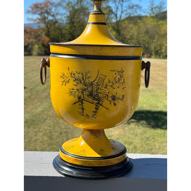 Classic French Empire Inspired Table Lamp. Mid 20th Century, in a strong mustard yellow with black and burnished brown...