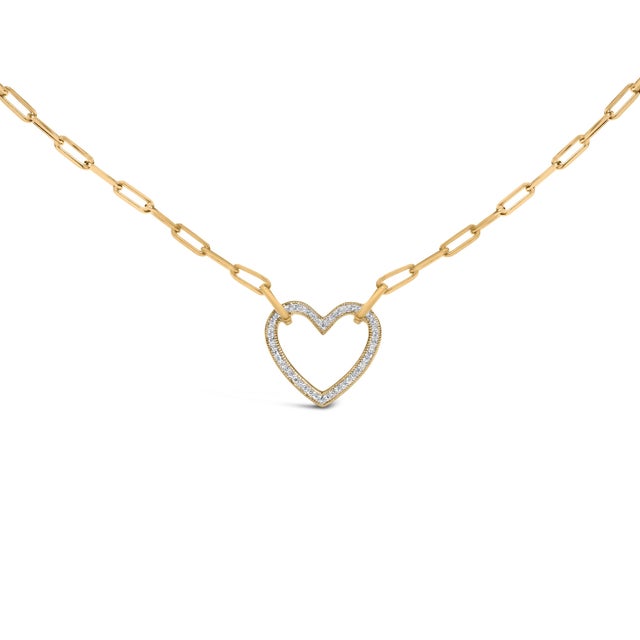Whispering romance in every gleam, this open-heart pendant traces a delicate outline edged with fine milgrain, its front...