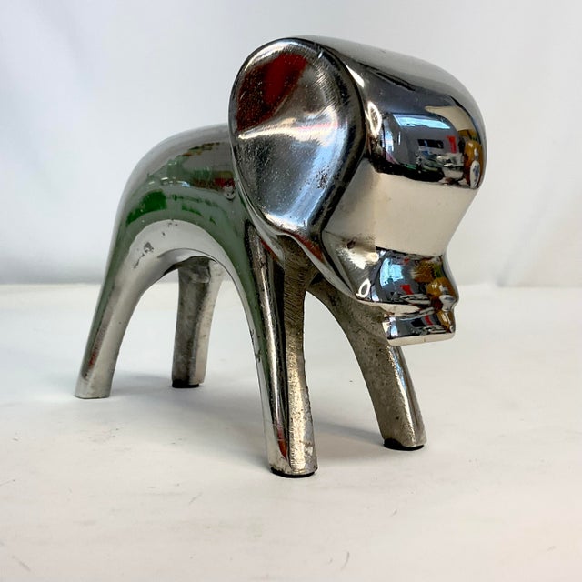 An abstract Danish designed Elephant sculpture by Dansk. The chrome colored metal is graphic in design and has created a...